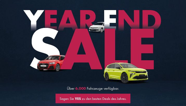 Grafik mit großem Schriftzug „Year End Sale“ und mehreren Autos davor, sowie Hinweisen auf über 6.000 verfügbare Fahrzeuge.
